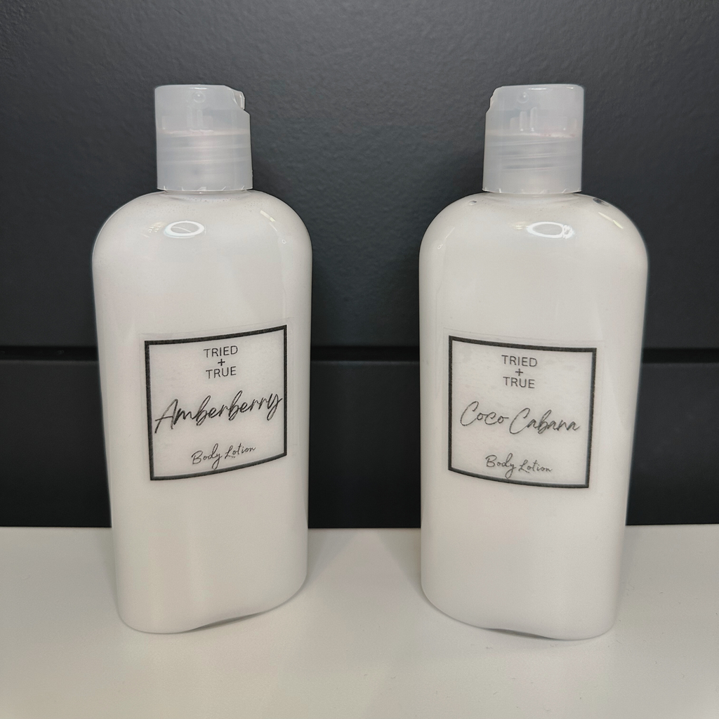 Two 3.8 oz Tried + True body lotion bottles labeled ‘Amberberry’ and ‘Coco Cabana.’